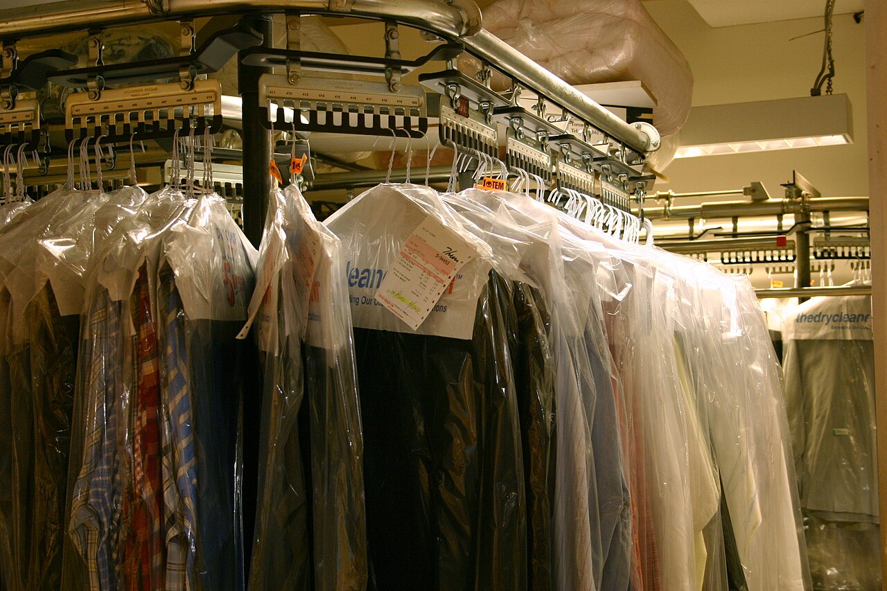 Rack of freshly cleaned garments on hangers